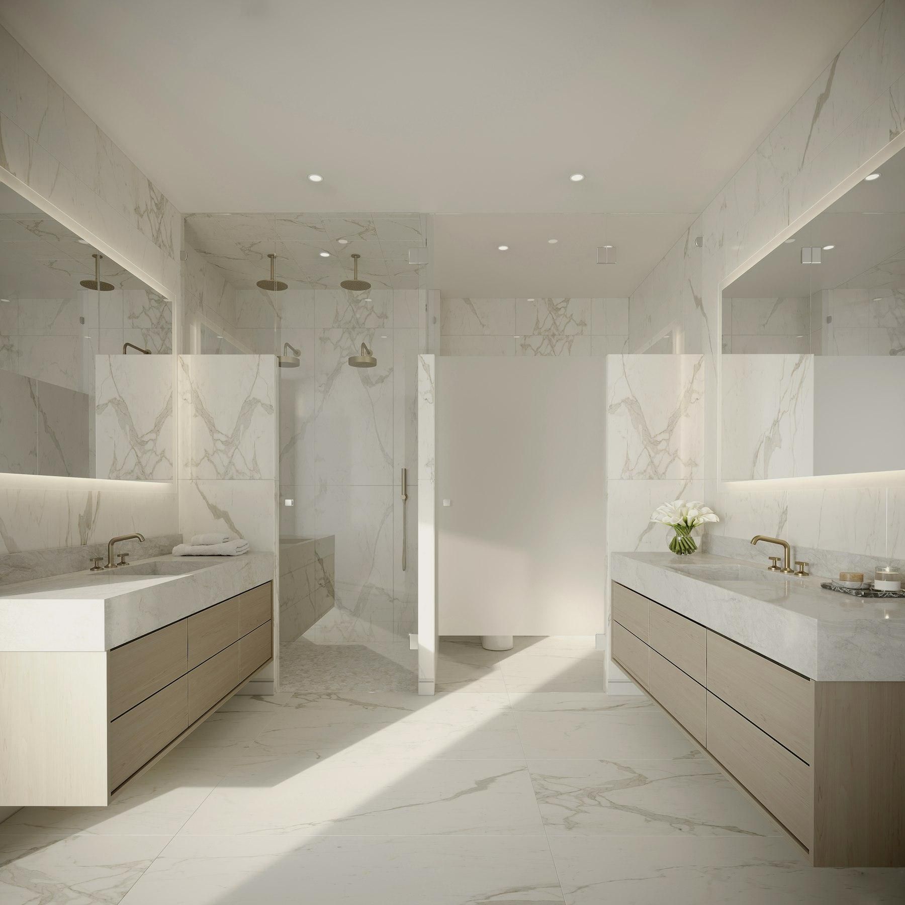 Large-format marble-look floor tile in a bath
